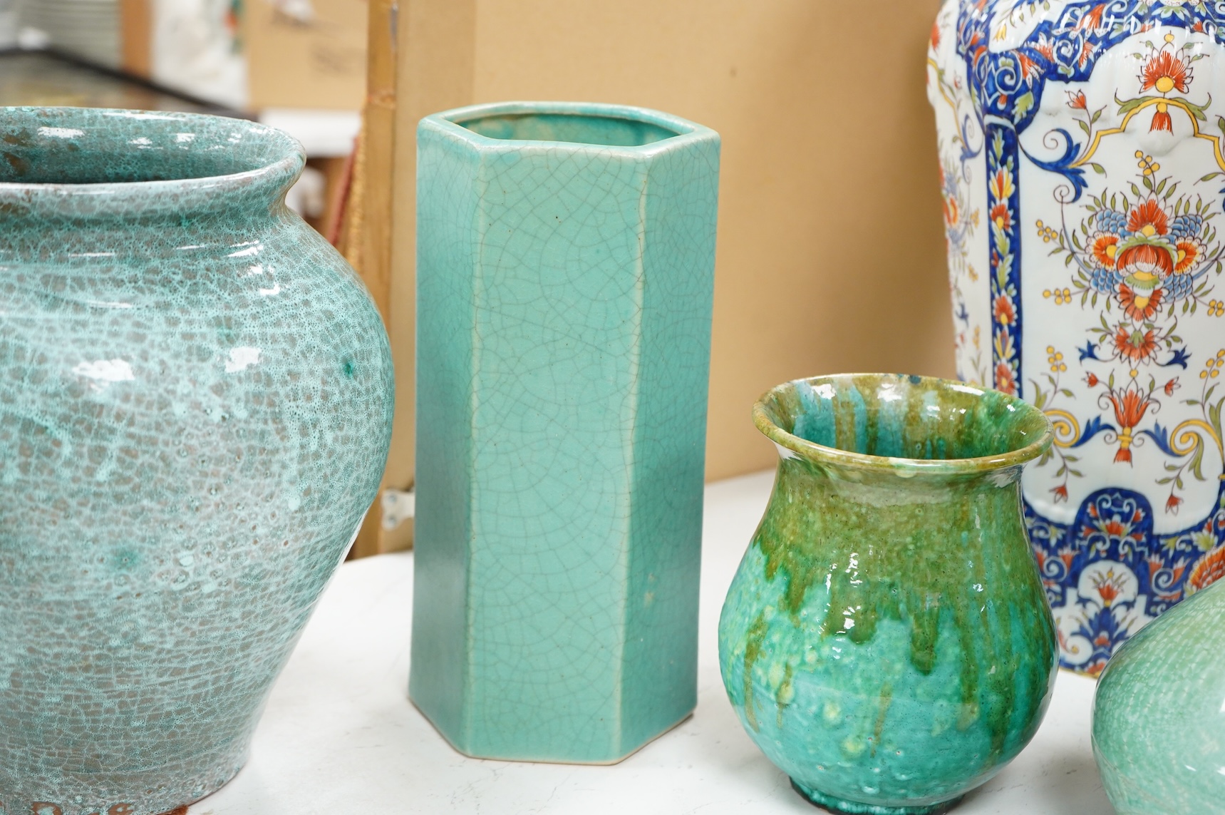A group of Continental green glazed earthenware vessels including a crystal glazed jug, largest 29cm high